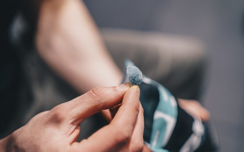 a person holding a bottle